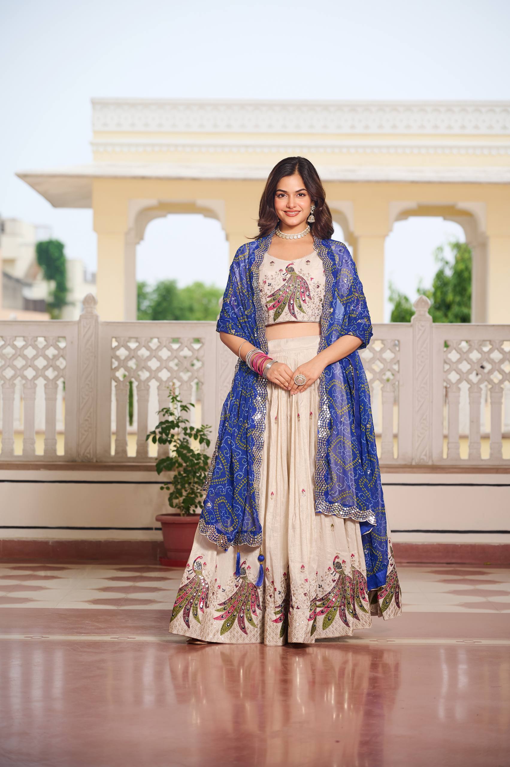 Designer Off-White Lehenga Choli with Heavy Thread Work and Contrast Bandhani Dupatta