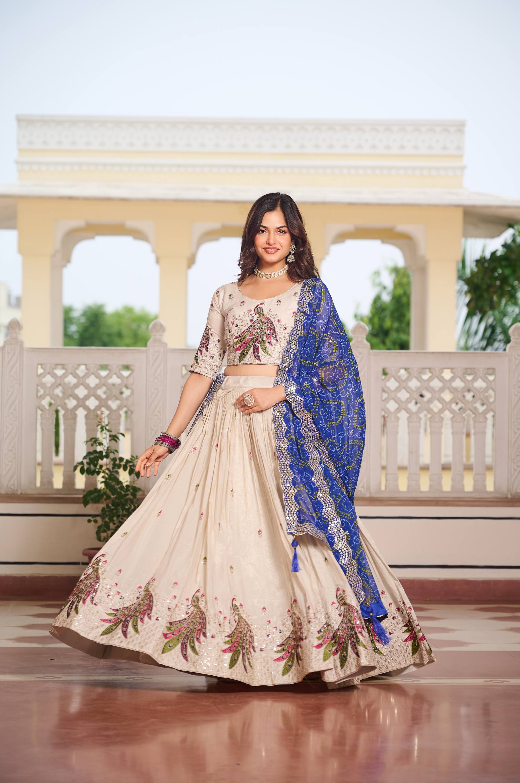 Designer Off-White Lehenga Choli with Heavy Thread Work and Contrast Bandhani Dupatta