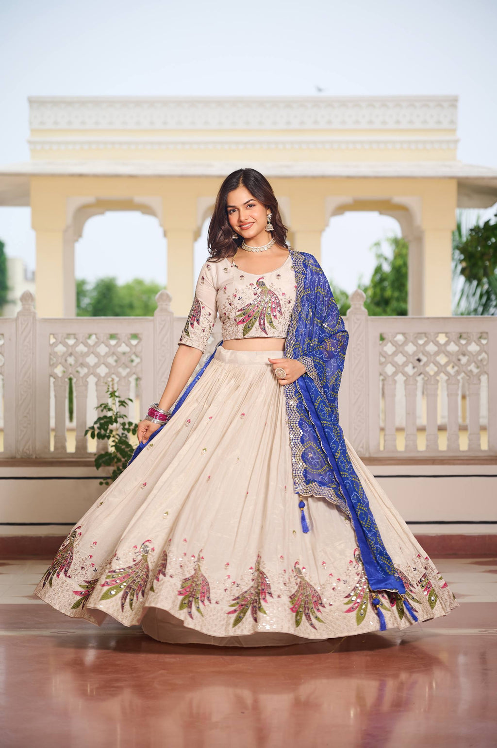 Designer Off-White Lehenga Choli with Heavy Thread Work and Contrast Bandhani Dupatta